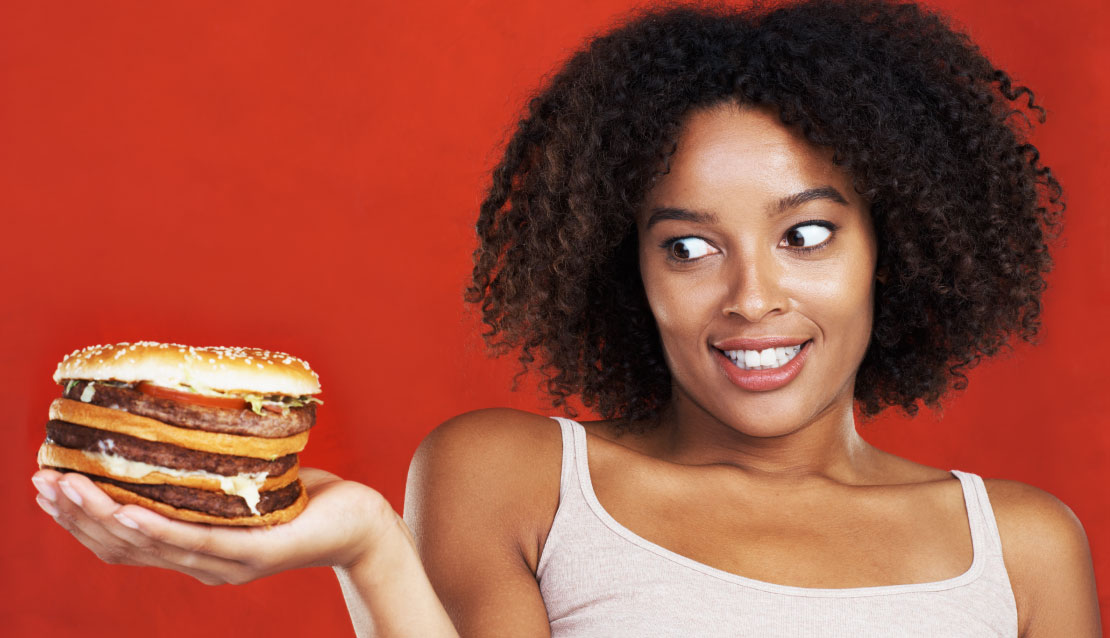 Girl looking at burger