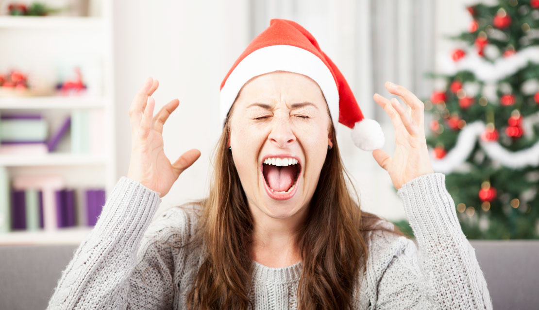 Stressed woman in Santa hat